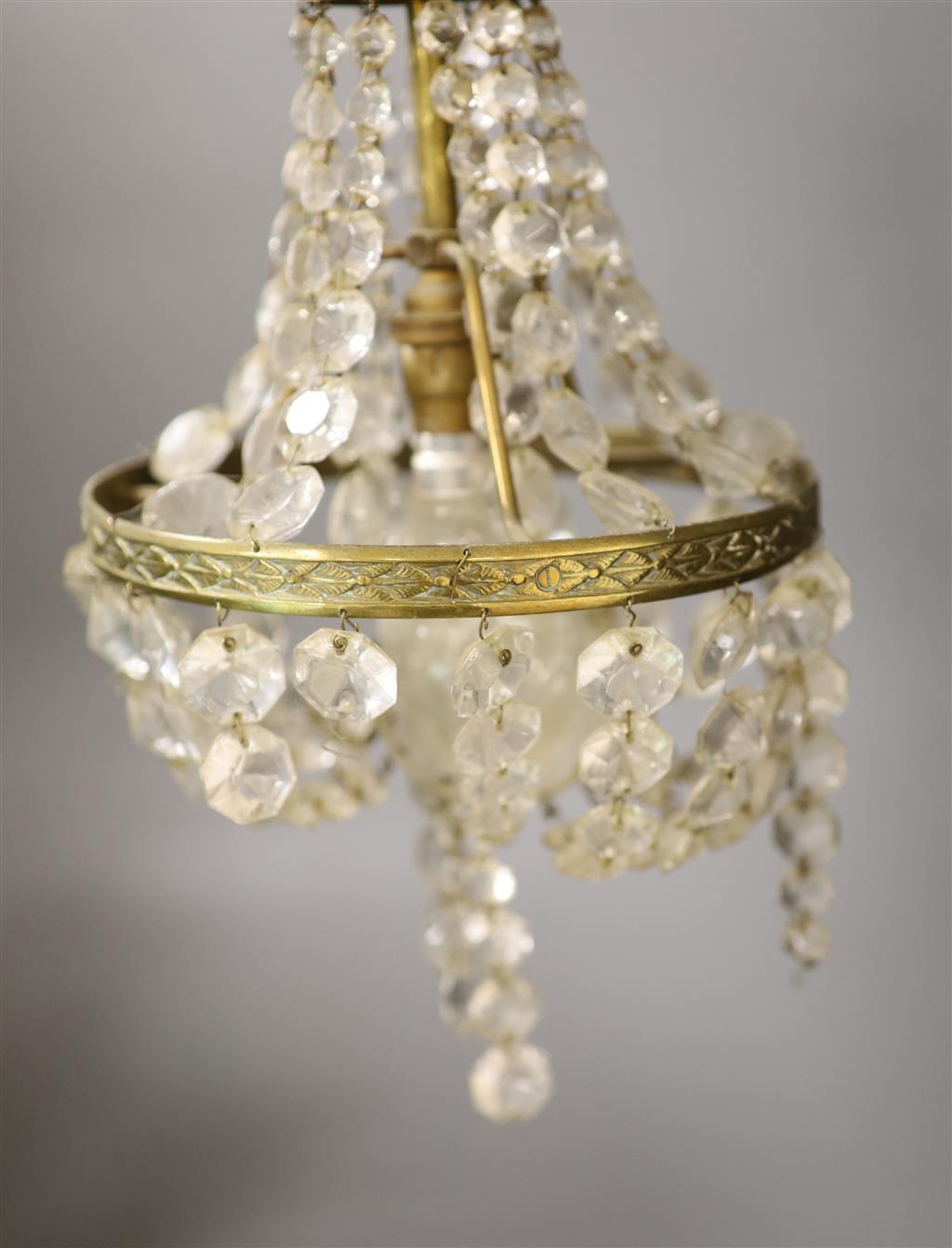 A pair of 20th century brass cut glass ceiling lights